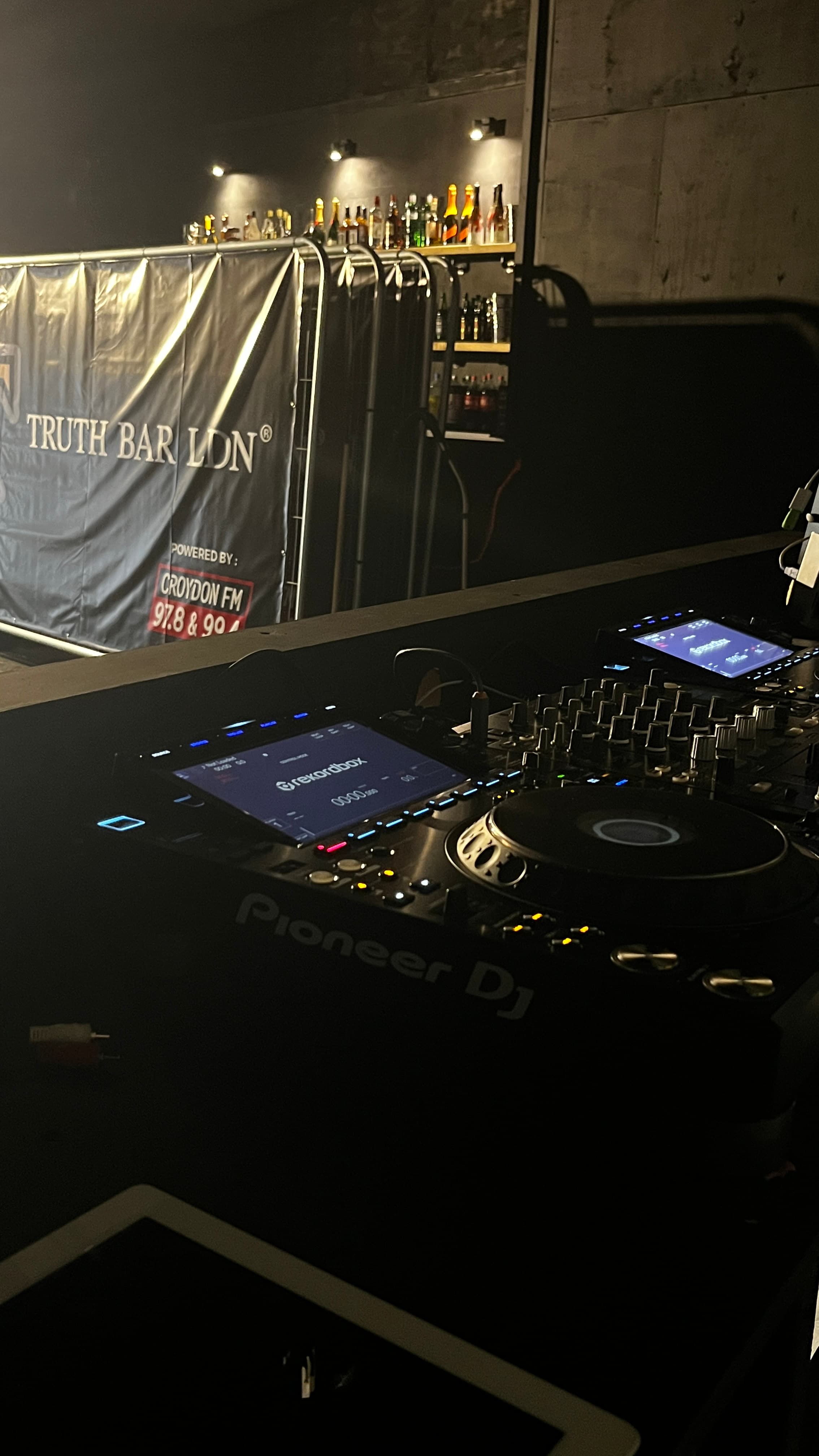 Professional DJ booth with Pioneer equipment for nightclub events and corporate production.