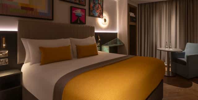 Modern hotel bedroom with plush bed, perfect for business or leisure stays in Shoreditch.