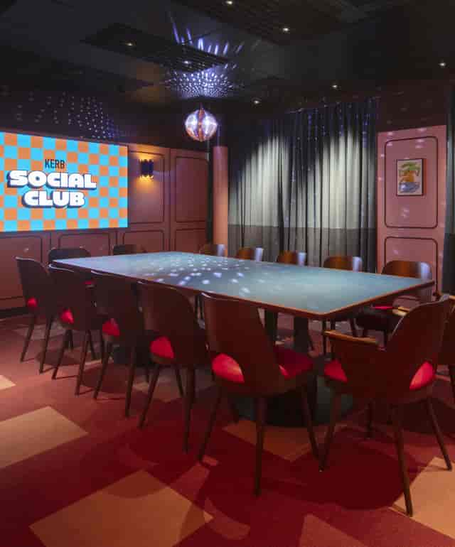 Modern meeting room in KERB Social Club, vibrant decor for creative events and networking.