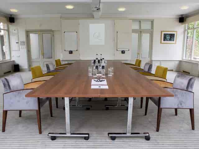 Boardroom setup in The Garden Room at Quy Mill Hotel, perfect for professional corporate meetings.