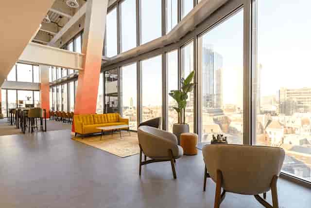 Modern XCHG meeting room with floor-to-ceiling windows for networking events and receptions.