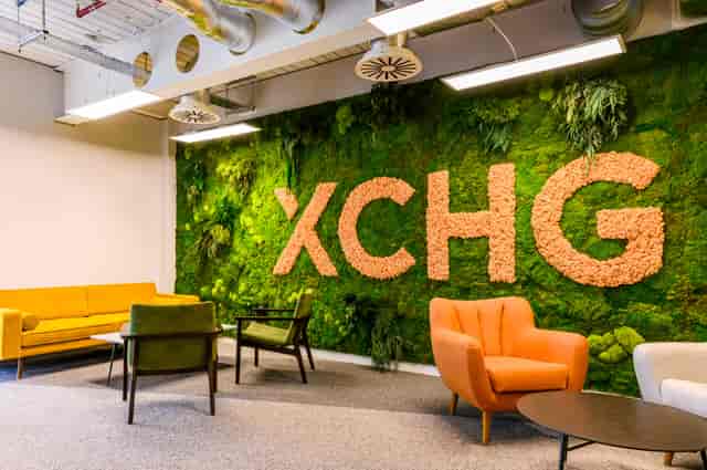 Biophilic XCHG meeting lounge for networking events and corporate photography.