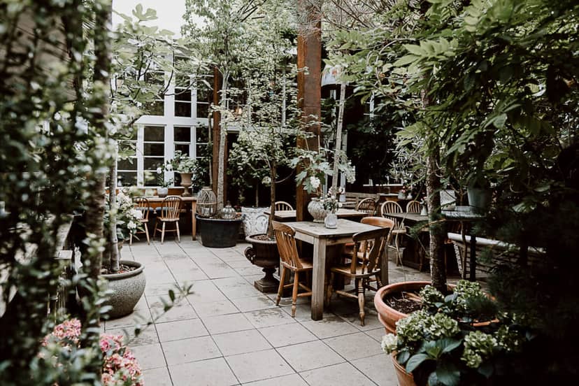 Garden patio with biophilic design for upscale breakout sessions and corporate welcome receptions.