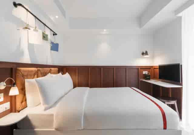 Ruby Stella Hotel room with modern decor, ideal for corporate travel and conference accommodation.