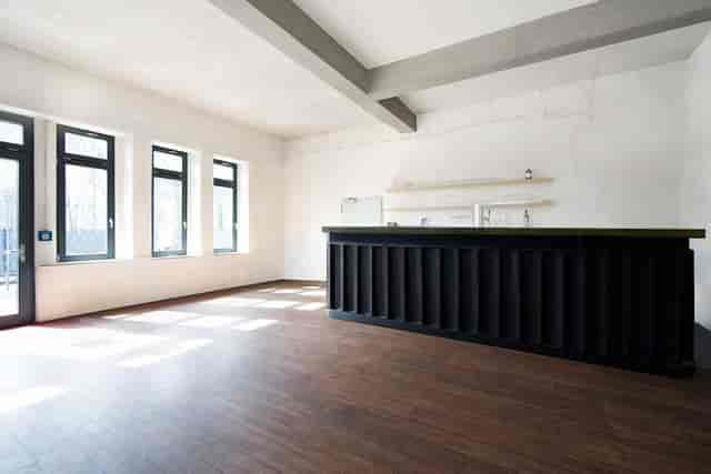 Industrial-chic event space in Düsseldorf for receptions and networking lounges.