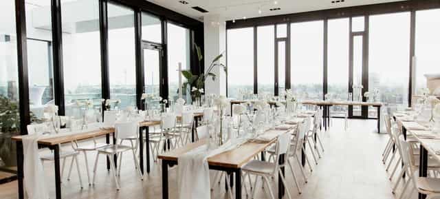 Amsterdam Lounge minimalist banquet hall with floor-to-ceiling windows for luxury event styling.