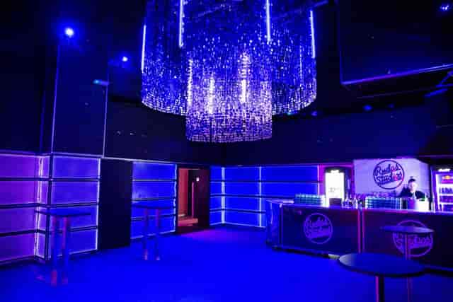 Rudas Studios lounge with LED-backlit walls for corporate events and evening receptions.