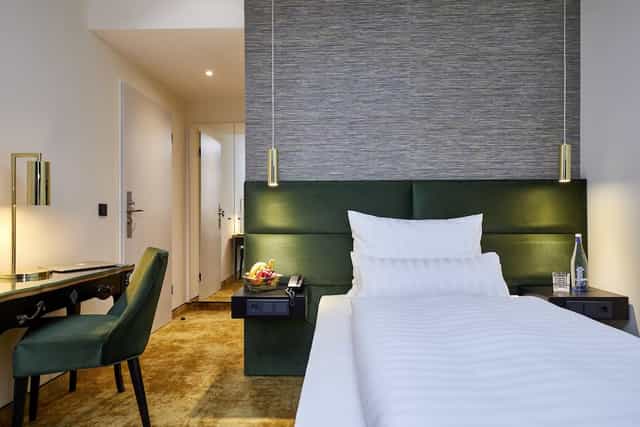 Carls Lounge guest room with workspace for business travel and corporate event accommodation.