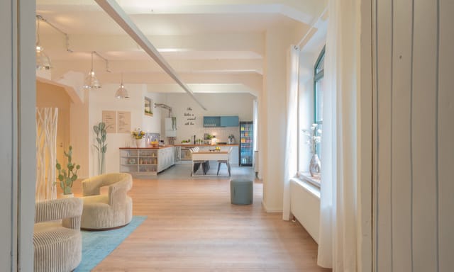 Open-plan Loft² workshop space with kitchen for networking and corporate events.
