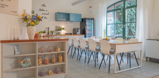 Loft² boardroom meeting space with natural light for corporate workshops and breakout events.