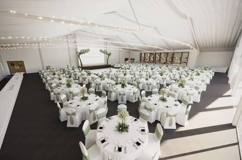King Suite event space with banquet seating and bistro lighting for social or corporate galas.
