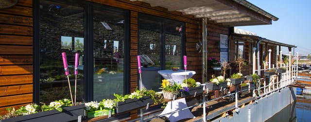 Fischers Kahn outdoor terrace with cocktail tables for networking event reception.