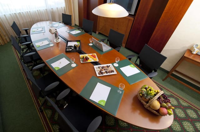 Boardroom setup at Courtyard Duesseldorf Hafen for professional business meetings and conferences.