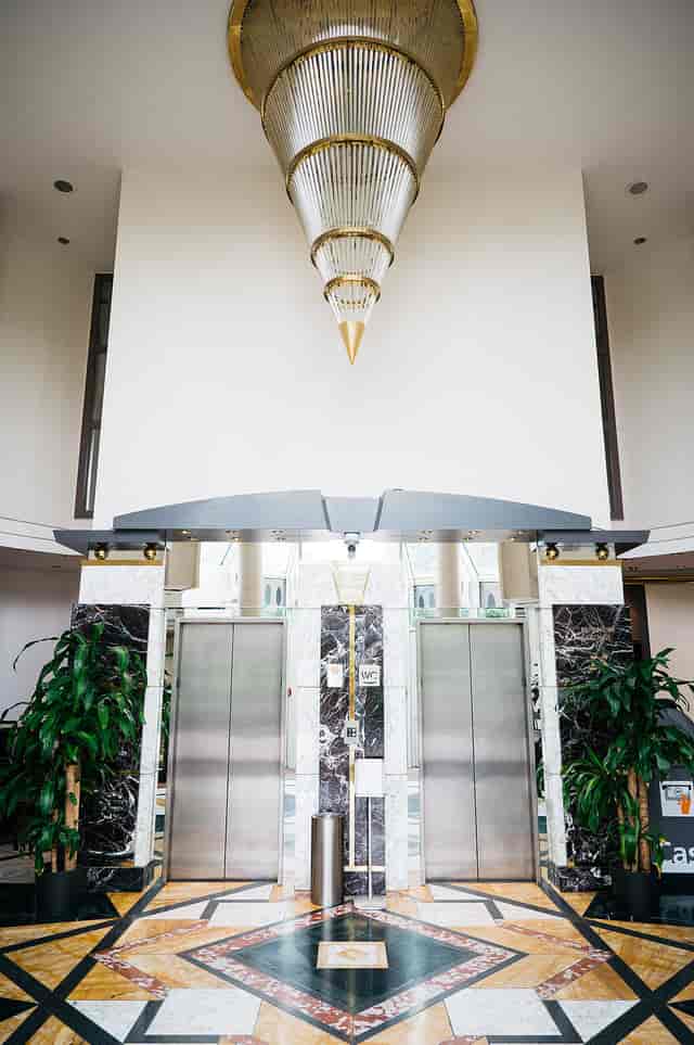 Lindner Hotel Dusseldorf Airport business lounge elevator bank for corporate event registration.