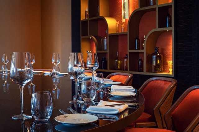 DOX Restaurant private dining room, elegant table setting for executive board dinners and VIP events.