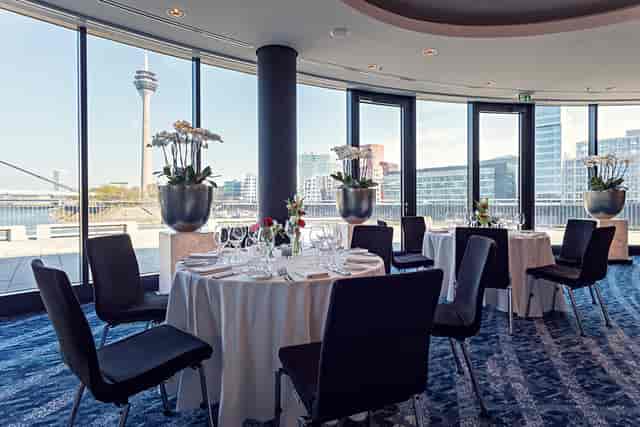 River Salon I event space at DOX with floor-to-ceiling windows for corporate dinners or networking.