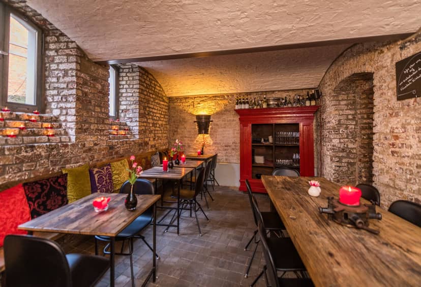 Rustic-chic wine bar in Schlossallee for private dining and micro-events.