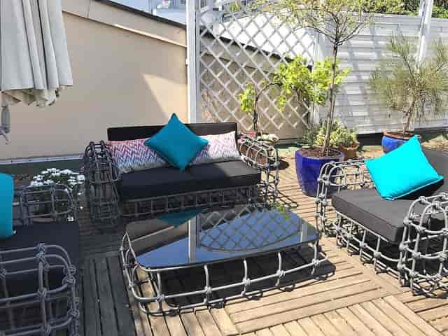 Deluxe rooftop suite with lounge seating for intimate networking and VIP corporate events.