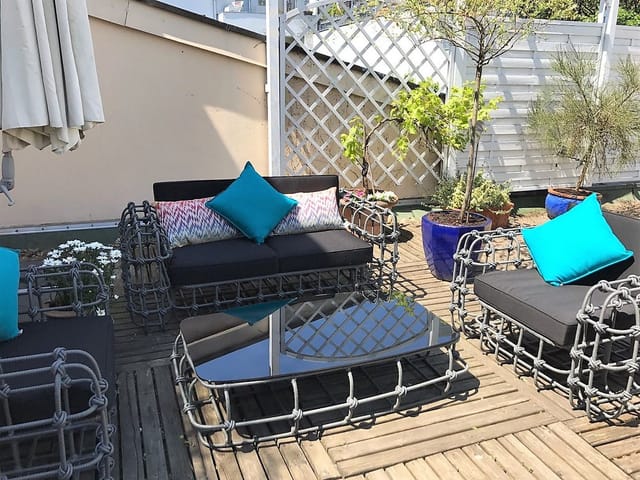 Deluxe rooftop suite with lounge seating for intimate networking and VIP corporate events.