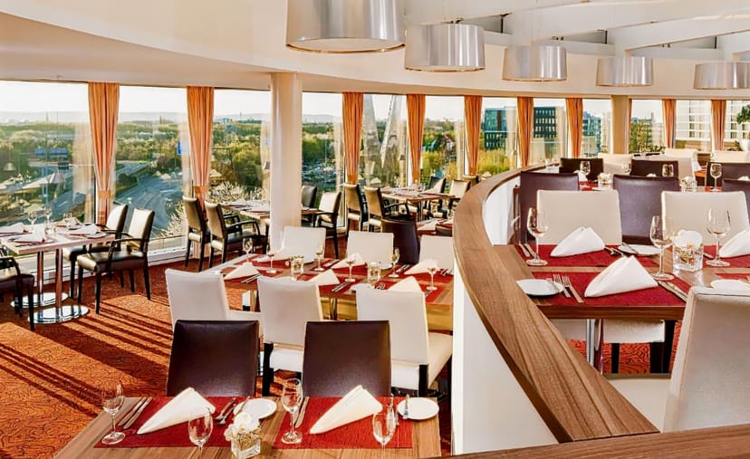 Sheraton Düsseldorf Airport Deck 5 dining space with panoramic views for corporate events.