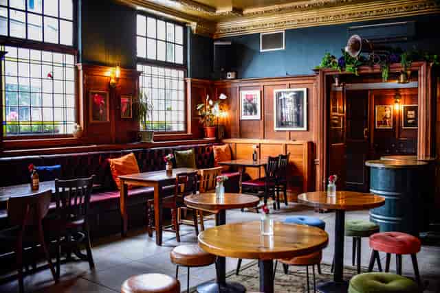 Bar in The Ram with wood paneling, ideal for networking receptions and team breakout events.