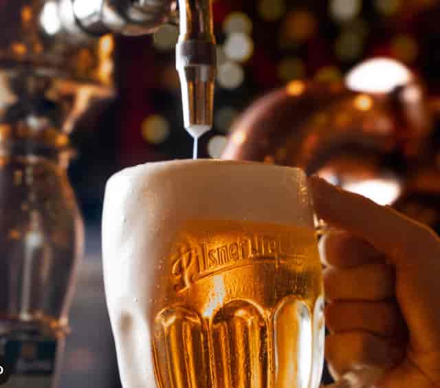 Frosty beer mug at Albert's Schloss, perfect for event catering and networking.