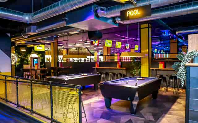 Vibrant entertainment venue with pool tables for casual networking events in Bristol.