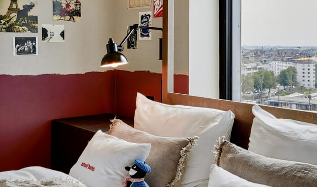 Thematic guest room at 25hours Hotel Das Tour for corporate retreats and creative summits.