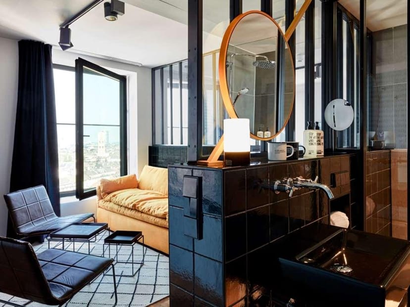 Modern 25hours Hotel suite with open design for corporate events and VIP stays.