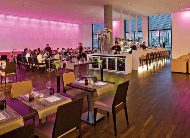 Modern conference venue in Düsseldorf with ambient mood lighting for professional networking events.