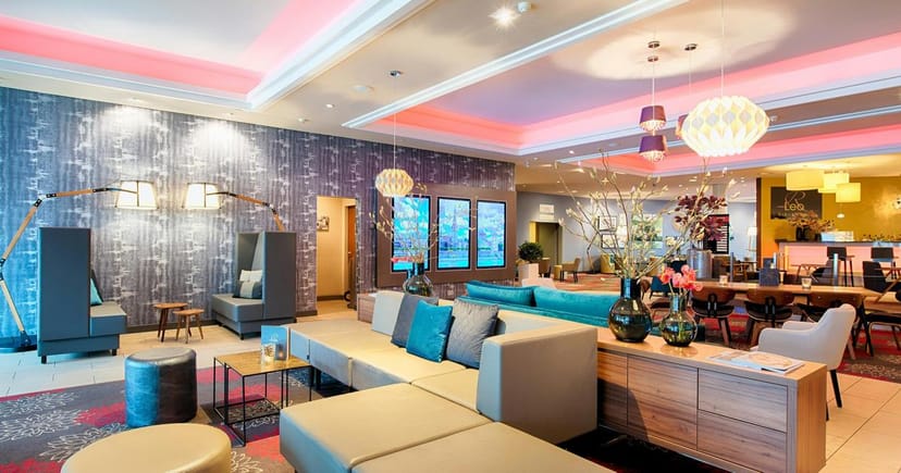 Contemporary hotel lobby with modular seating for business networking and corporate events.