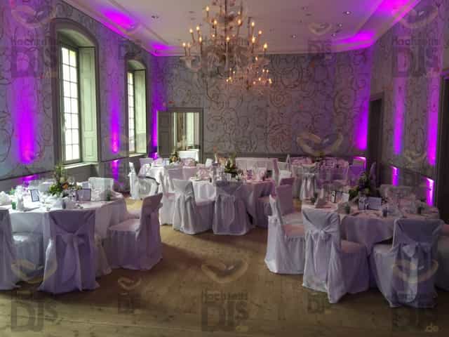 Purple uplighting in Roland-Weber-Festsaal ballroom for gala or wedding reception.