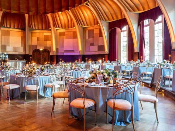 Silbersaal Rheinterrasse gala dinner with blue linens and gold chairs, luxury event venue.