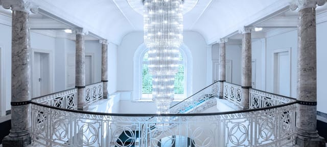 Elegant gala entrance stage at Villa Boisserée, premium event registration area.