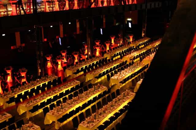 Palladium Köln gala setup with industrial-chic banquet seating and atmospheric lighting.