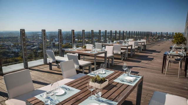 Savoy Hotel Köln rooftop terrace: panoramic venue for upscale networking and VIP dining.