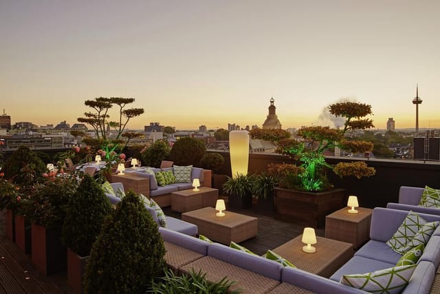 Savoy Hotel Köln rooftop terrace with lounge seating for corporate cocktail and VIP networking.
