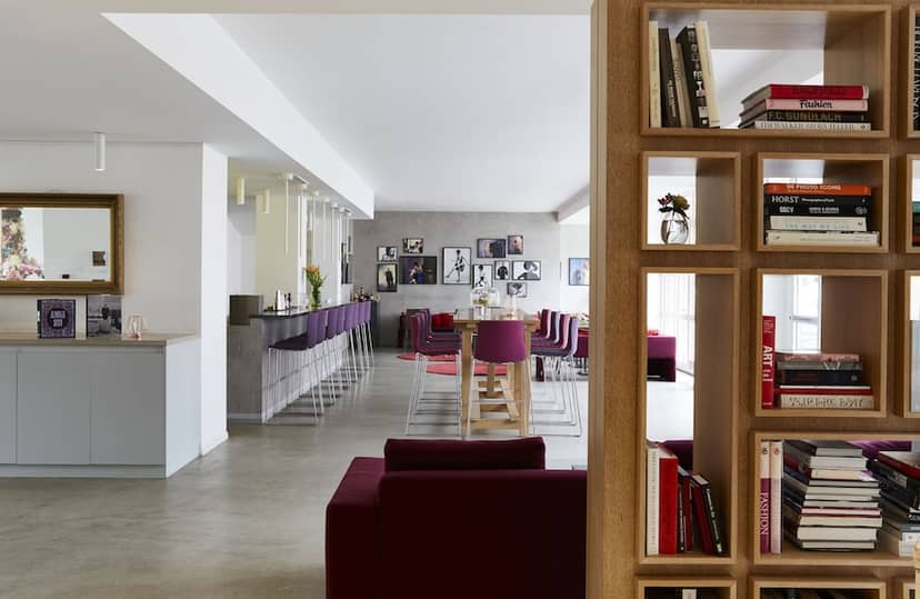 Modern conference breakout space with tiered seating for professional networking and workshops.