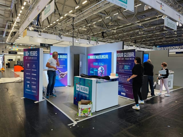 DMEXCO Innovation Stage exhibitor booth setup with modern modular branding for trade show events.