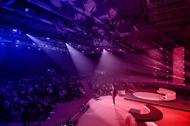 Keynote session with curved stage at DMEXCO digital marketing conference event.