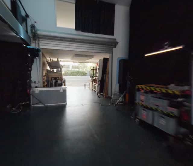 Behind-the-scenes view of Westside Studios event space, showcasing logistics and technical setups.