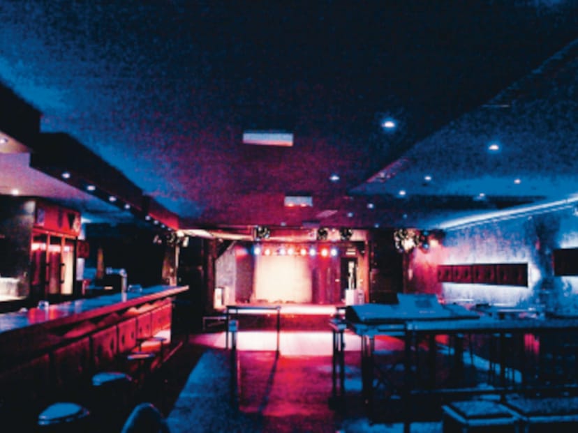 Luxor function room with stage and bar for networking events and social mixers.