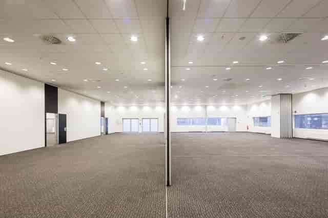 Event Hall at XPOST: Versatile ballroom with airwall partition for corporate events and conferences.