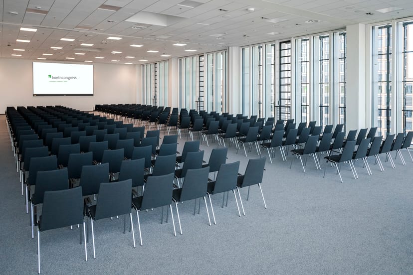 Modern conference center with floor-to-ceiling windows, ideal for corporate plenary sessions.