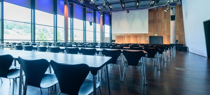 MediaPark Köln conference room, classroom style, corporate presentation space.