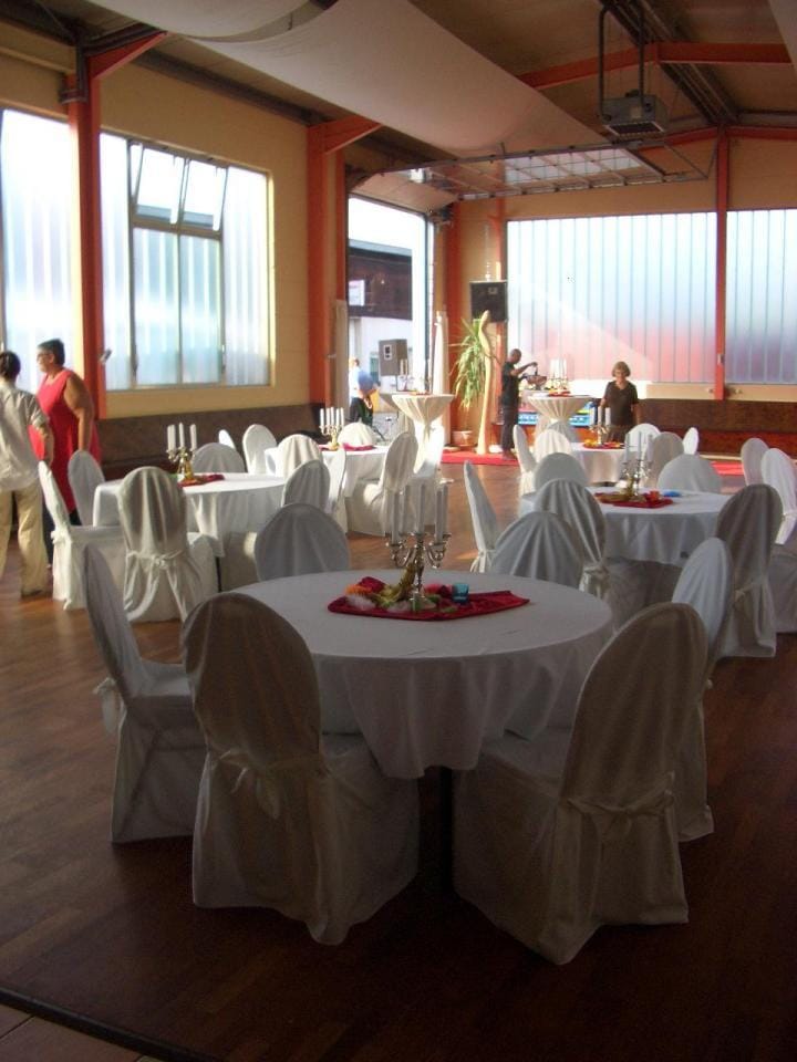 Sato Deluxe Ballroom with elegant banquet setup for corporate mixers and social events.