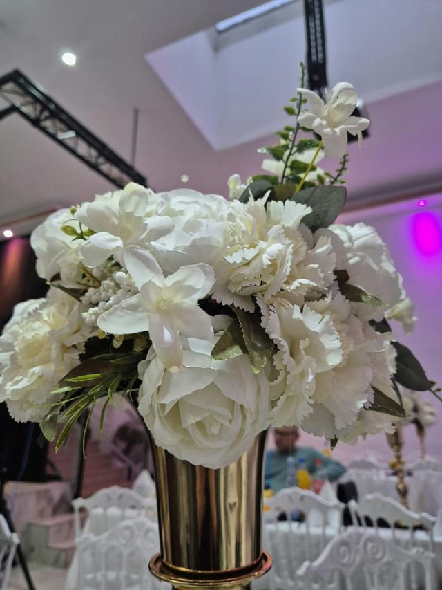 Silk floral centerpiece at Sato Deluxe Ballroom for elegant, budget-friendly wedding event decor.