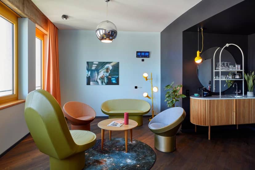 Satellites breakout room at 25hours Hotel with mid-century lounge seating for creative workshops.
