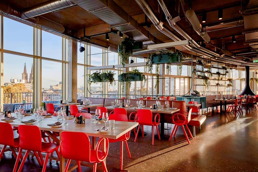Industrial-chic rooftop venue at 25hours Hotel for corporate networking and stylish events.