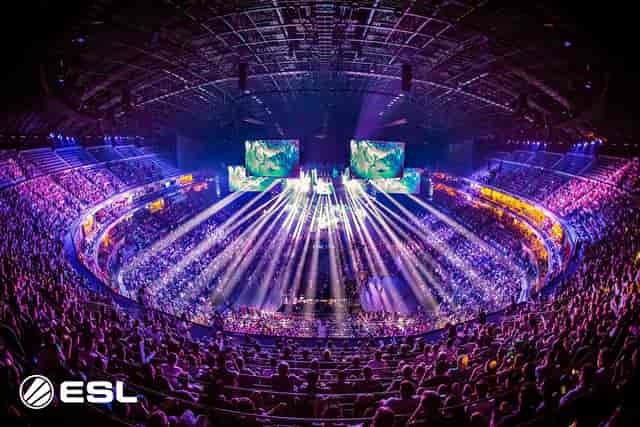 360-degree esports arena stage with immersive LED screens and lighting at LANXESS event.
